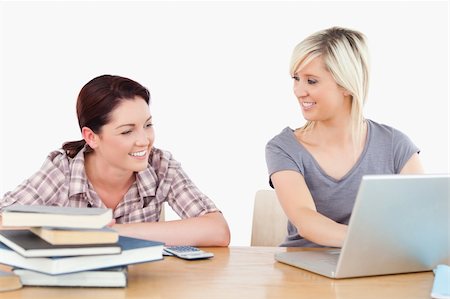 simsearch:400-05357982,k - Two pretty women learning with a laptop and books Stock Photo - Budget Royalty-Free & Subscription, Code: 400-05358779