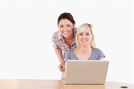 simsearch:400-05357982,k - Best Friends with a laptop in a studio Stock Photo - Budget Royalty-Free & Subscription, Code: 400-05358787