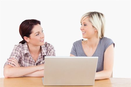 simsearch:400-05357982,k - Two pretty women learning with a notebook at a table Stock Photo - Budget Royalty-Free & Subscription, Code: 400-05358783