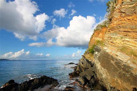 Jagged rock wall rising from the sea on the Caribbean island of Tortola. Stock Photo - Budget Royalty-Free & Subscription, Code: 400-05350127