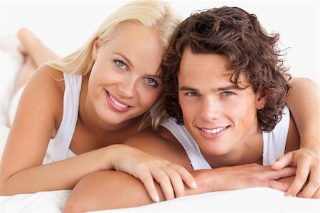 simsearch:400-04341692,k - Couple lying on their bed in the bedroom Stock Photo - Budget Royalty-Free & Subscription, Code: 400-05350228