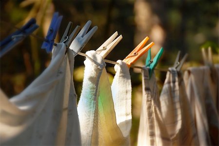 peg - drying laundry line with clothes pegs outdoors closeup Stock Photo - Budget Royalty-Free & Subscription, Code: 400-05350295