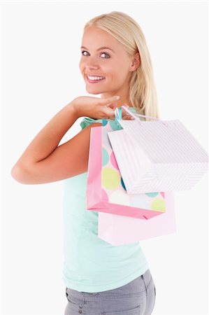 simsearch:400-04904785,k - Close up of a Joyful woman with some shopping bags in a studio Stock Photo - Budget Royalty-Free & Subscription, Code: 400-05350399