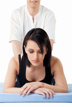 simsearch:400-05352124,k - Young woman receiving lower back thai massage from a man, eyes closed Stock Photo - Budget Royalty-Free & Subscription, Code: 400-05352116