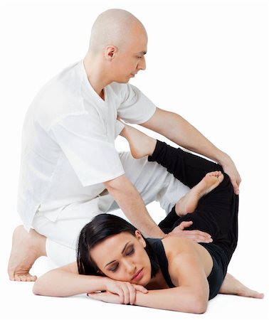 simsearch:400-05352116,k - Young female receiving massage in thai position by therapist, eyes closed Photographie de stock - Aubaine LD & Abonnement, Code: 400-05352121