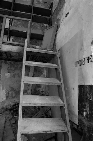 simsearch:859-03983026,k - Wooden crumbling attic staircase and fire extinguisher sign in abandoned factory interior. Black and white. Stock Photo - Budget Royalty-Free & Subscription, Code: 400-05352414