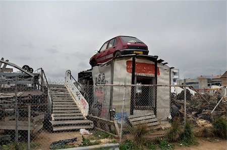 derelict car - Rusty car and scrap metal at a junkyard. Stock Photo - Budget Royalty-Free & Subscription, Code: 400-05352523