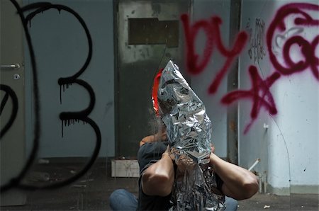 Distorted man emerging through broken glass mirror in abandoned interior. Stock Photo - Budget Royalty-Free & Subscription, Code: 400-05352586