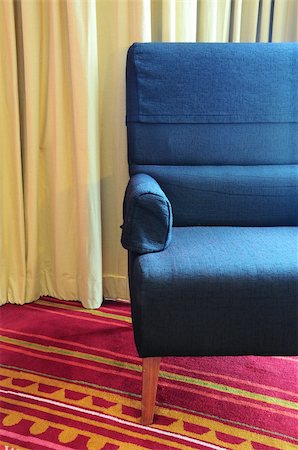 simsearch:846-03164688,k - old single sofa seat in front of a curtain Photographie de stock - Aubaine LD & Abonnement, Code: 400-05353601