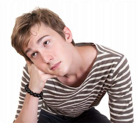 simsearch:400-05388090,k - Bored Caucasian teen with hand on chin over white background Stock Photo - Budget Royalty-Free & Subscription, Code: 400-05353788