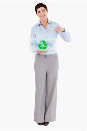 simsearch:400-07301131,k - Woman putting a plastic bottle in a recycling box against a white background Stock Photo - Budget Royalty-Free & Subscription, Code: 400-05353881