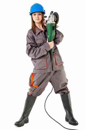 Beautiful young female with workwear and boots standing and holding grinder Stock Photo - Budget Royalty-Free & Subscription, Code: 400-05360309