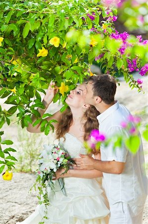 simsearch:400-05328142,k - Bride and groom in a tropical garden Stock Photo - Budget Royalty-Free & Subscription, Code: 400-05363802