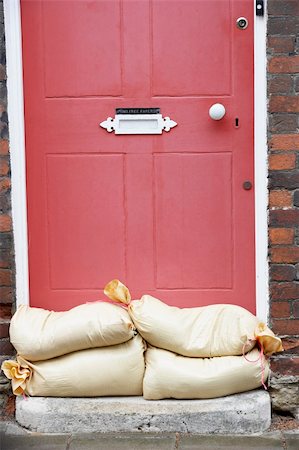 flooded homes - Sandbags Stacked In A Doorway In Preparation For Flooding Stock Photo - Budget Royalty-Free & Subscription, Code: 400-05374280