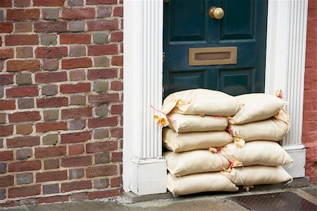 flooded homes - Sandbags Stacked In A Doorway In Preparation For Flooding Stock Photo - Budget Royalty-Free & Subscription, Code: 400-05374282