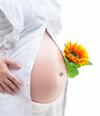 simsearch:400-05716366,k - Young Mother holding a sunflower on white background Stock Photo - Budget Royalty-Free & Subscription, Code: 400-05376525