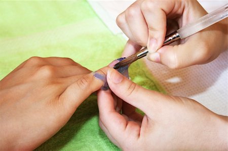 Hands during the manicure work. Foto de stock - Super Valor sin royalties y Suscripción, Código: 400-05376704