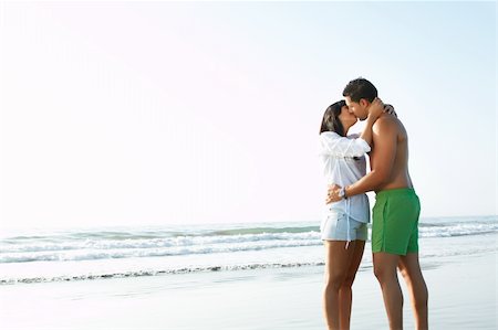 simsearch:6109-06195487,k - portrait of an adorable  couple in love kissing and embracing each other on the edge of the beach Stock Photo - Budget Royalty-Free & Subscription, Code: 400-05379097