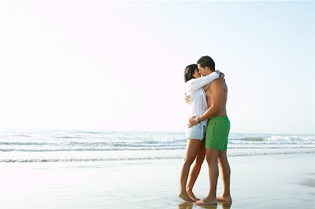 simsearch:6109-06195487,k - portrait of an adorable  couple in love kissing and embracing each other on the edge of the beach Stock Photo - Budget Royalty-Free & Subscription, Code: 400-05379099