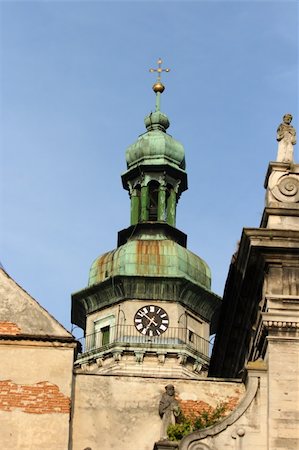 statues on building top - Lvov. Ukraine. Dome with a cross Stock Photo - Budget Royalty-Free & Subscription, Code: 400-05371509