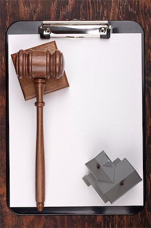 Justice gavel and house model on a clipboard. Add your text to the paper. Stock Photo - Budget Royalty-Free & Subscription, Code: 400-05386013