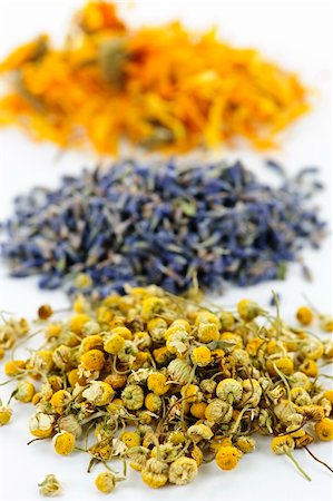 Piles of dried medicinal herbs camomile, lavender, calendula on white background Stock Photo - Budget Royalty-Free & Subscription, Code: 400-05386043