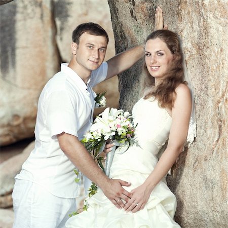 simsearch:400-05328142,k - Bride and groom on the beach. Tropical wedding Stock Photo - Budget Royalty-Free & Subscription, Code: 400-05386294