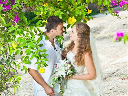 simsearch:400-05328142,k - Bride and groom in a tropical garden Stock Photo - Budget Royalty-Free & Subscription, Code: 400-05386296
