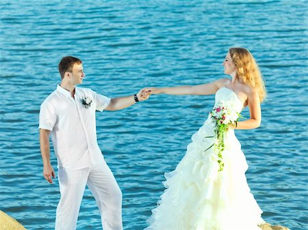 simsearch:400-05328142,k - Bride and groom on the beach. Tropical wedding Stock Photo - Budget Royalty-Free & Subscription, Code: 400-05386290