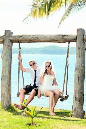simsearch:400-05328142,k - Bride and groom on the tropical beach Stock Photo - Budget Royalty-Free & Subscription, Code: 400-05386313