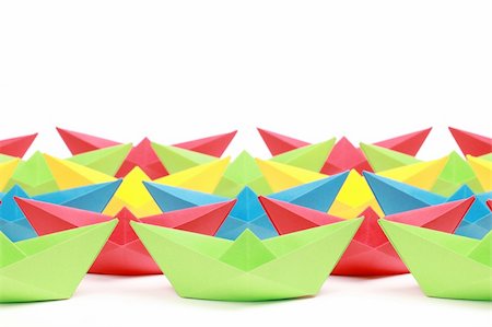 Several colored paper boats on white background Stock Photo - Budget Royalty-Free & Subscription, Code: 400-05387600