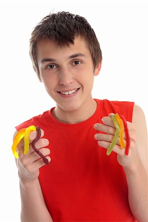 snake images for kids - A smiling happy boy holding handfuls of yummy snakes lollies. Stock Photo - Budget Royalty-Free & Subscription, Code: 400-05388662