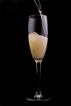 simsearch:400-04558755,k - Wine being poured into a glass on black background Stock Photo - Budget Royalty-Free & Subscription, Code: 400-05388805