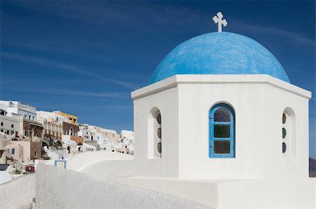 simsearch:400-04898640,k - One of the famous blue dome chapels in the village of Oia, Santorini, Greece Stock Photo - Budget Royalty-Free & Subscription, Code: 400-05382172