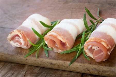 simsearch:400-04885499,k - Slices of rolled bacon with rosemary Stock Photo - Budget Royalty-Free & Subscription, Code: 400-05382452