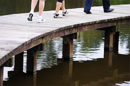 Crossing the wooden bridge in wetland park Stock Photo - Budget Royalty-Free & Subscription, Code: 400-05382785