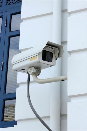 A CCTV Camera on the white wall Stock Photo - Budget Royalty-Free & Subscription, Code: 400-05664503