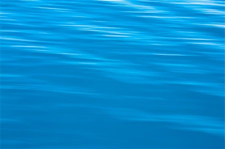 simsearch:400-04058760,k - Small waves on water surface in motion blur. Photographie de stock - Aubaine LD & Abonnement, Code: 400-05666527
