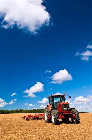 Small scale farming with tractor and plow in field Stock Photo - Budget Royalty-Free & Subscription, Code: 400-05669637