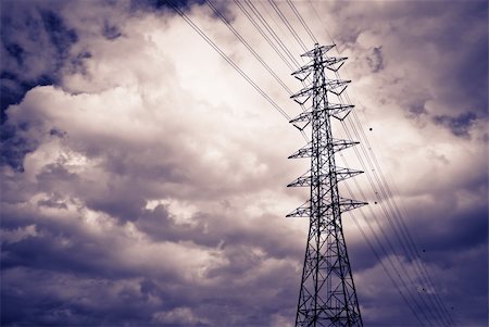High power electrical pole on a cloudy day with silhouette Stock Photo - Budget Royalty-Free & Subscription, Code: 400-05669655