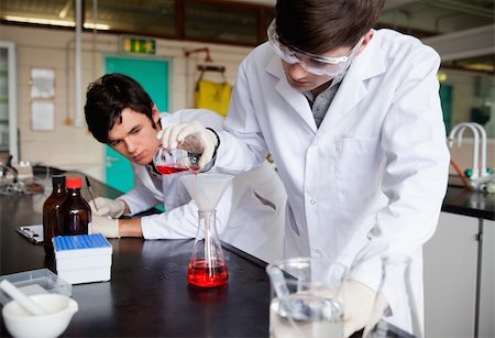 Young chemistry students making an experiment in a laboratory Stock Photo - Budget Royalty-Free & Subscription, Code: 400-05669760