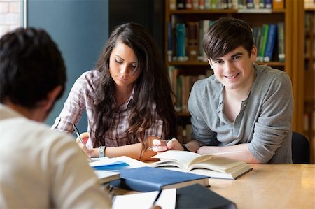 simsearch:400-05669803,k - Students getting set for an assignment in a library Stock Photo - Budget Royalty-Free & Subscription, Code: 400-05669777