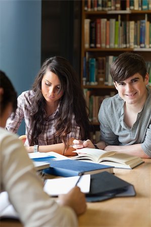 Portrait of students preparing an assignment in a library Stock Photo - Budget Royalty-Free & Subscription, Code: 400-05669788