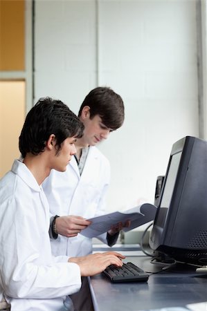 Male scientists using a monitor in a laboratory Stock Photo - Budget Royalty-Free & Subscription, Code: 400-05669795