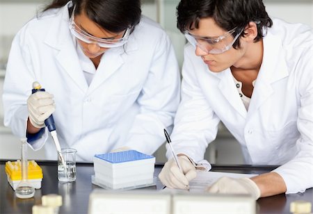 Scientists making an experiment in a laboratory Stock Photo - Budget Royalty-Free & Subscription, Code: 400-05669866