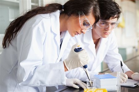 Serious science students making an experiment in a laboratory Stock Photo - Budget Royalty-Free & Subscription, Code: 400-05669868