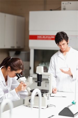 simsearch:400-05669968,k - Portrait of young science students making experiments in a laboratory Stock Photo - Budget Royalty-Free & Subscription, Code: 400-05669980