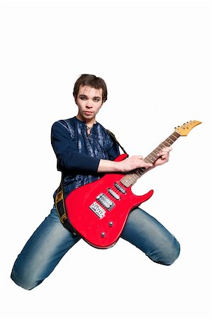 picture of the blue playing a instruments - Young guitarist with electric guitar on white background Stock Photo - Budget Royalty-Free & Subscription, Code: 400-05663334