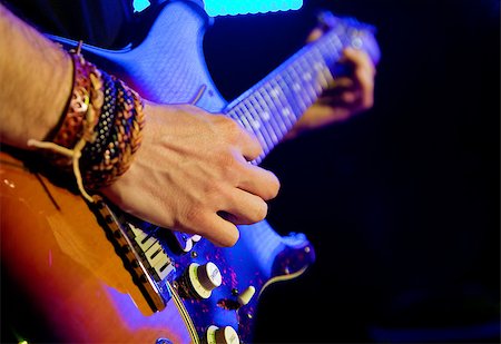 Live music image with guitar player in first plane Photographie de stock - Aubaine LD & Abonnement, Code: 400-05663850