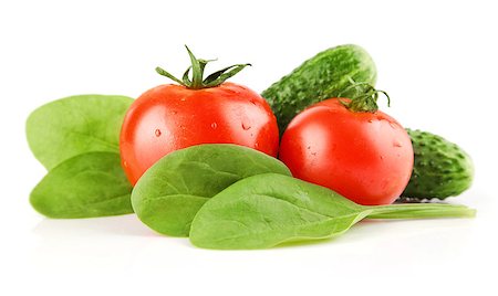 simsearch:400-05664137,k - fresh tomato vegetables with cucumbers and spinach  leaves isolated on white background Stock Photo - Budget Royalty-Free & Subscription, Code: 400-05663959